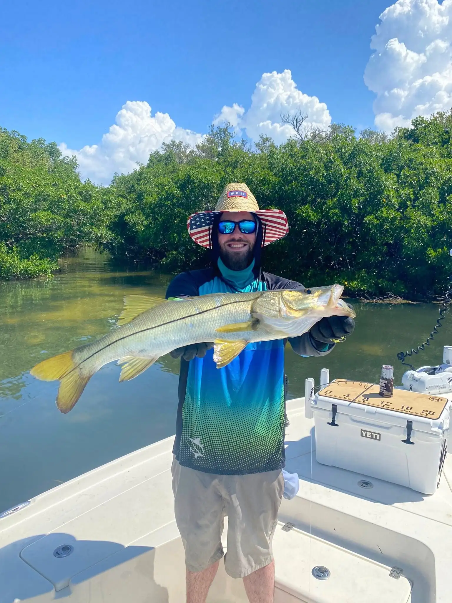 Customer posing with a snook caught during a Tampa Bay charter trip